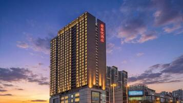 A high-rise hotel with multiple floors and a prominent entrance.