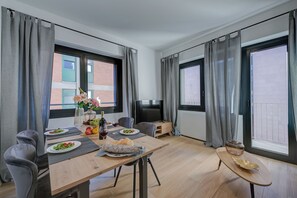 Enjoy a romantic dinner for two at this elegant dining area, complete with a beautifully set table and comfortable seating.