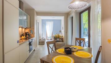 Standard Apartment | Living area | 40-inch flat-screen TV with cable channels, TV