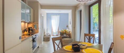 Standard Apartment | Living area | 40-inch flat-screen TV with cable channels, TV