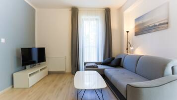 Traditional Apartment | Living area | 40-inch flat-screen TV with cable channels, TV