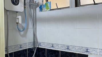 Bathtub, hair dryer, towels, soap
