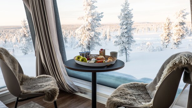A cozy room with a view of a snowy forest. - Aurora Collection Saariselkä (Saariselka)