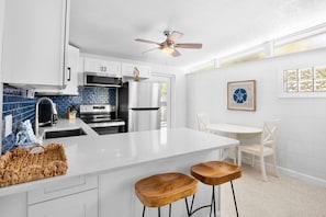 Fridge, microwave, oven, stovetop - Home with Private Backyard and Heated Pool - Gulf Breeze Villa B (Holmes Beach)