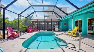 A heated pool, sun loungers