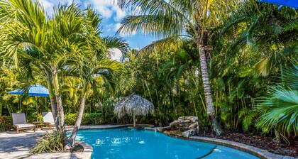 Vibrant Island Retreat with Pool, Tiki Table and Walk to Beach