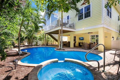Beautiful home with fenced yard, heated pool, hot tub, and elevator!