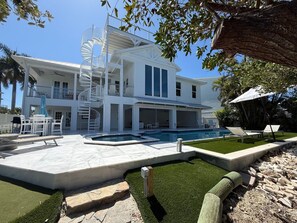A heated pool - Canal Front Home with Pool, Spa and Rooftop Deck! (Anna Maria)