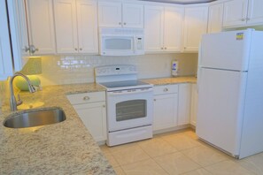 Fridge, microwave, oven, stovetop - Remodeled Duplex with Heated Pool, 2 Blocks to the Beach! (Anna Maria)