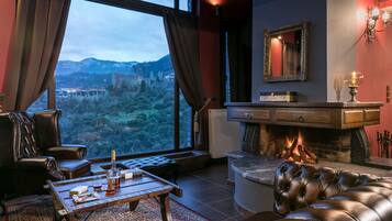 Älytelevisio, takka, DVD-soitin, kirjoja