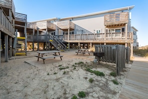 Enjoy outdoor dining and social gatherings on the multi-level deck with picnic tables and a barbecue grill.