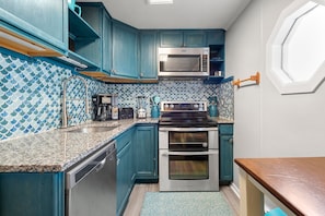 Enjoy cooking in this kitchen with a dishwasher, microwave, and oven, plus a coffee maker.