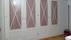 A set of white wardrobe doors with a cross pattern design. - Impeccable 1-bed House in Sayalonga (Sayalonga)