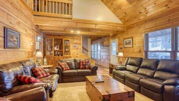 Télévision, cheminée, lecteur de DVD, baby-foot