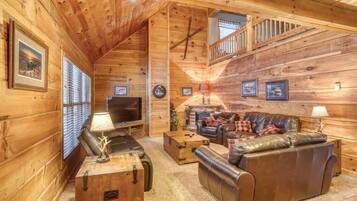 Télévision, cheminée, lecteur de DVD, baby-foot