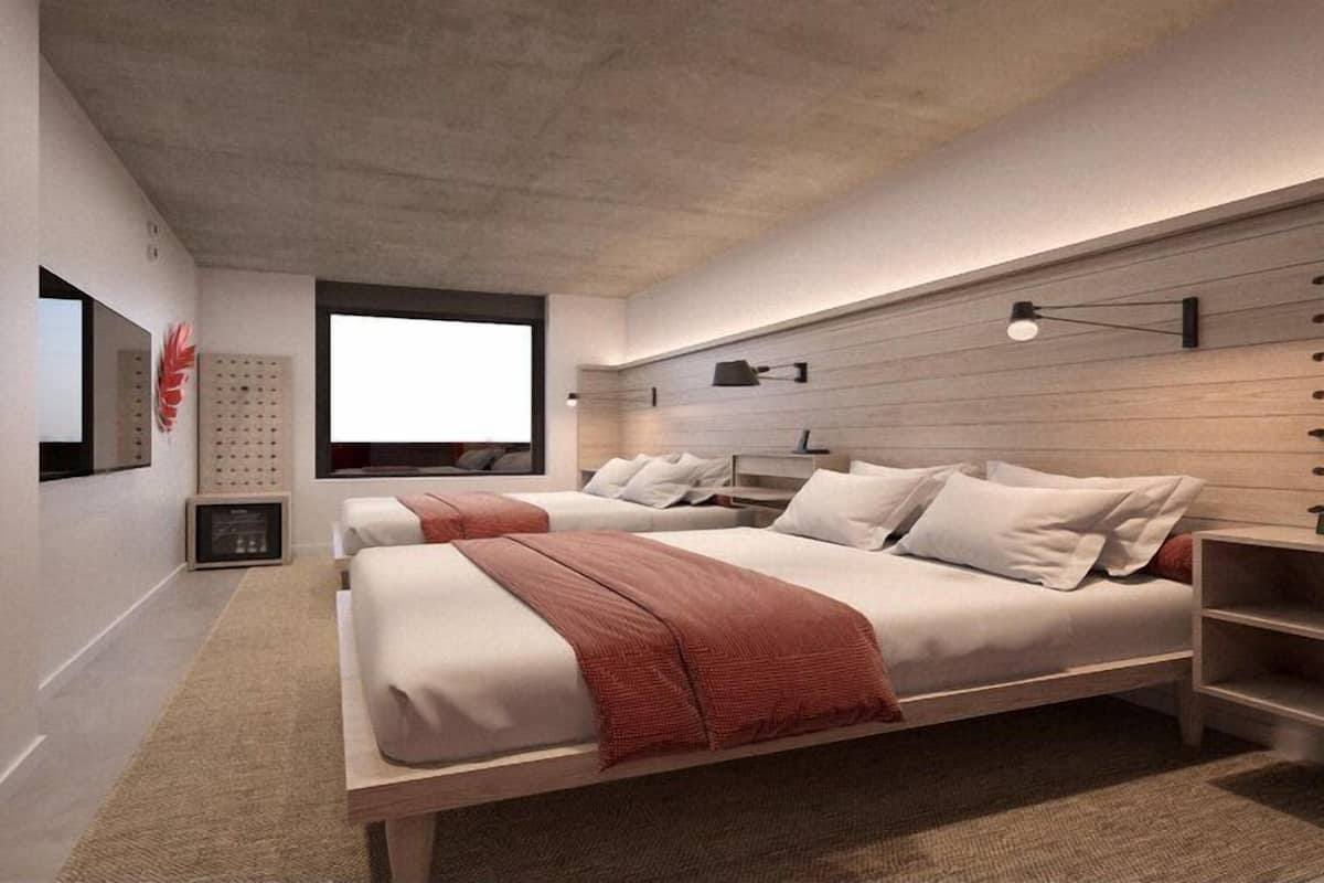 A modern bedroom with a large bed, bedside tables, a window, and a wall-mounted shelf.
