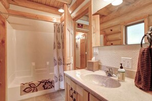 Bathtub, hair dryer, towels