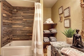Bathtub, hair dryer, towels