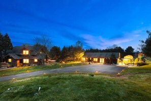 A log cabin-style building with multiple rooms, a paved driveway, and a playground. - Private Cabin · Heated Pool, Sauna & Hot Tub · 2 Acres (Tunkhannock)