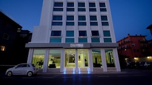 A modern hotel building with a prominent entrance and a sign indicating it is a 5-star establishment. - San Giuliano (Mestre)