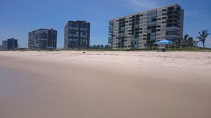 On the beach, sun-loungers, beach towels