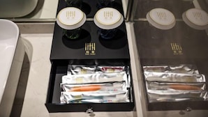 A drawer with toothbrushes and toothpaste tubes. - Boke Hotel Guangzhou Zhujiang New Town (Guangzhou)