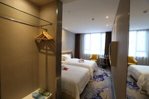 A hotel room with two beds, a mirror, a wardrobe, a desk, and a chair. - Boke Hotel Guangzhou Zhujiang New Town (Guangzhou)