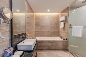 A modern bathroom with a large mirror, a rectangular sink, and a freestanding bathtub. - Zhuangzi International Hotel (Mengcheng)