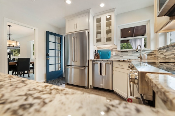 Kitchen with easy access to dining area and outdoor space.