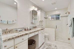 Combined shower/tub, hair dryer, towels, soap