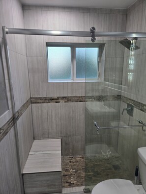 Bathtub, hair dryer, towels, soap