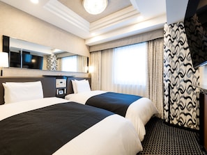 Tvåbäddsrum Deluxe - icke-rökare | Duntäcken, skrivbord, mörkläggningsgardiner och gratis wi-fi