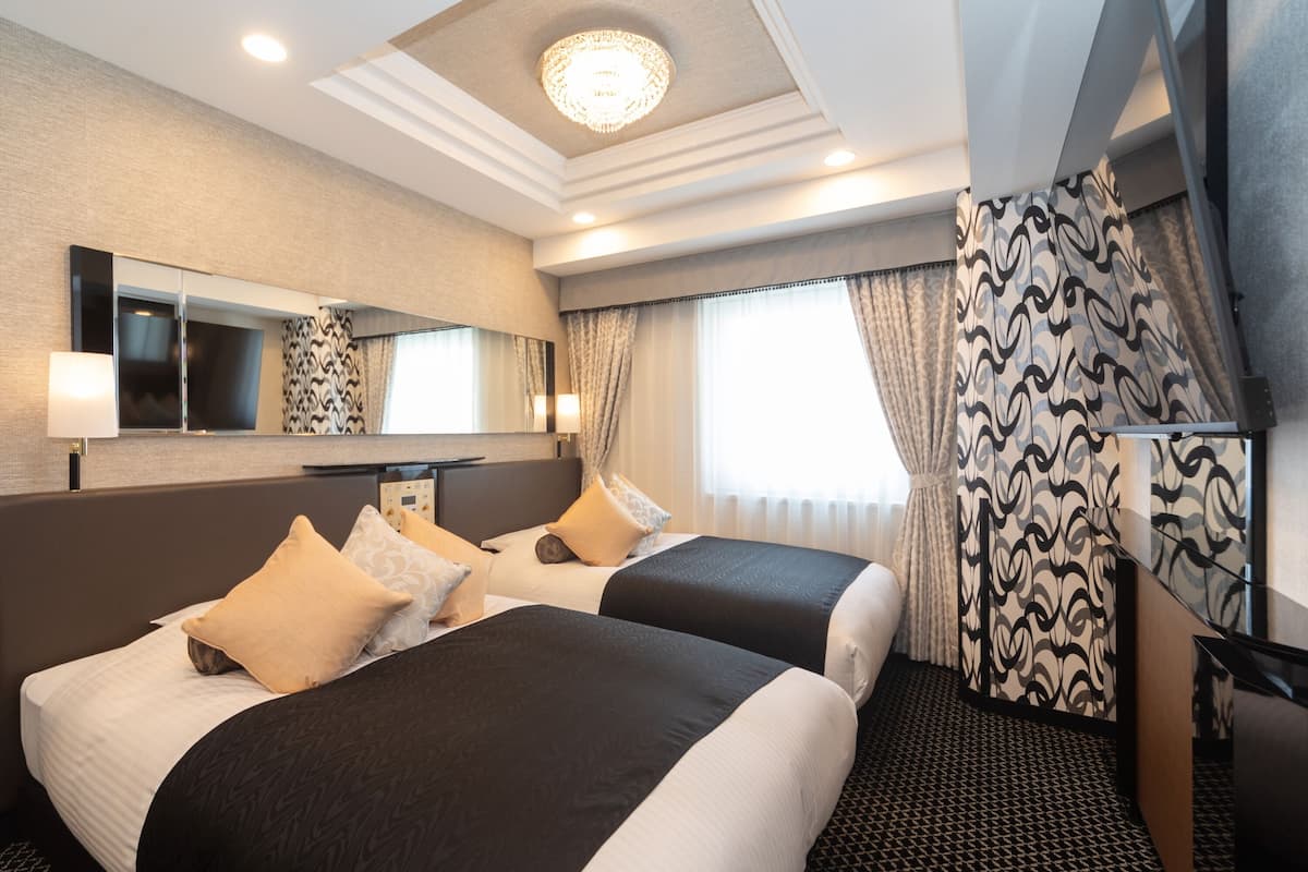 Deluxe Twin Room, Non Smoking | Down comforters, desk, blackout drapes, free WiFi