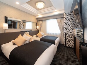 Habitación Deluxe con 2 camas individuales, para no fumadores | Edredón, escritorio, cortinas blackout y wifi gratis 