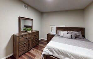 Sleep in comfort with a large bed and convenient nightstands.