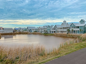 Houses line the waterfront, offering serene views of the waterway.