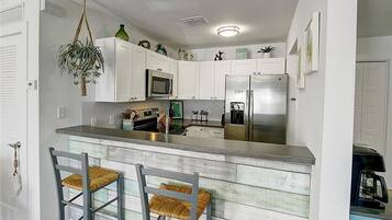 Coffee/tea maker, fridge, microwave, oven