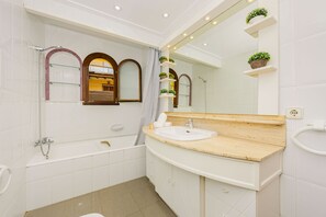 Bathtub, hair dryer, towels