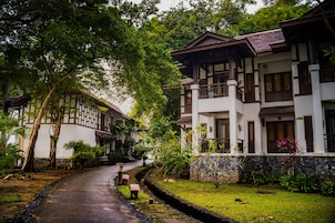 A traditional building with a stone pathway leading to the entrance.