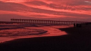 A pier extending into the water with a sunset sky. - 1 Galway Girl 3 Bedroom Home by RedAwning (Supply)