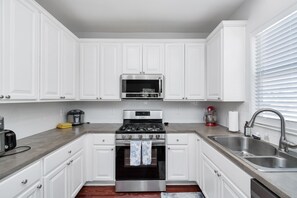 Fridge, microwave, oven, stovetop - Summer Bliss | 3BR Home, Walk to Beach • Master Suite • Sleeps 9 (Galveston)