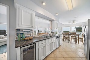 Enjoy meals in the kitchen with a dining area and large window offering a view of the surrounding landscape.