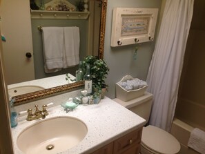 Combined shower/bathtub, hair dryer, towels, soap - Beach Front Condo - Fifth Floor With Balcony (Indian Shores)