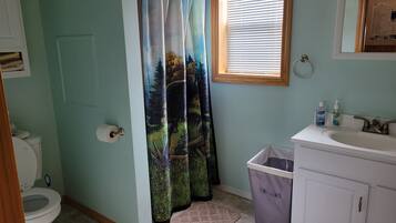 Shower, hair dryer, towels, toilet paper