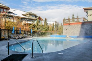 Outdoor pool, a heated pool - Modern Alpine Views near BANFF 2 BR/BA heated pool hottub deck & Park Pass (Canmore)