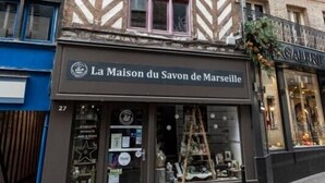 A building with a sign reading "La Maison du Savon de Marseille."
