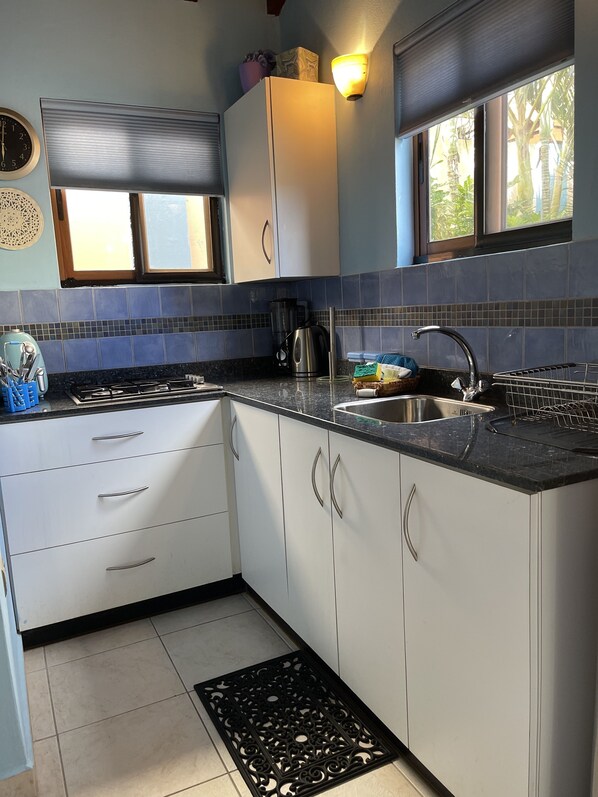 Microwave, coffee/tea maker, cookware/dishes/utensils, paper towels
