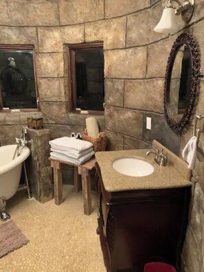 Bathtub, hair dryer, towels, soap