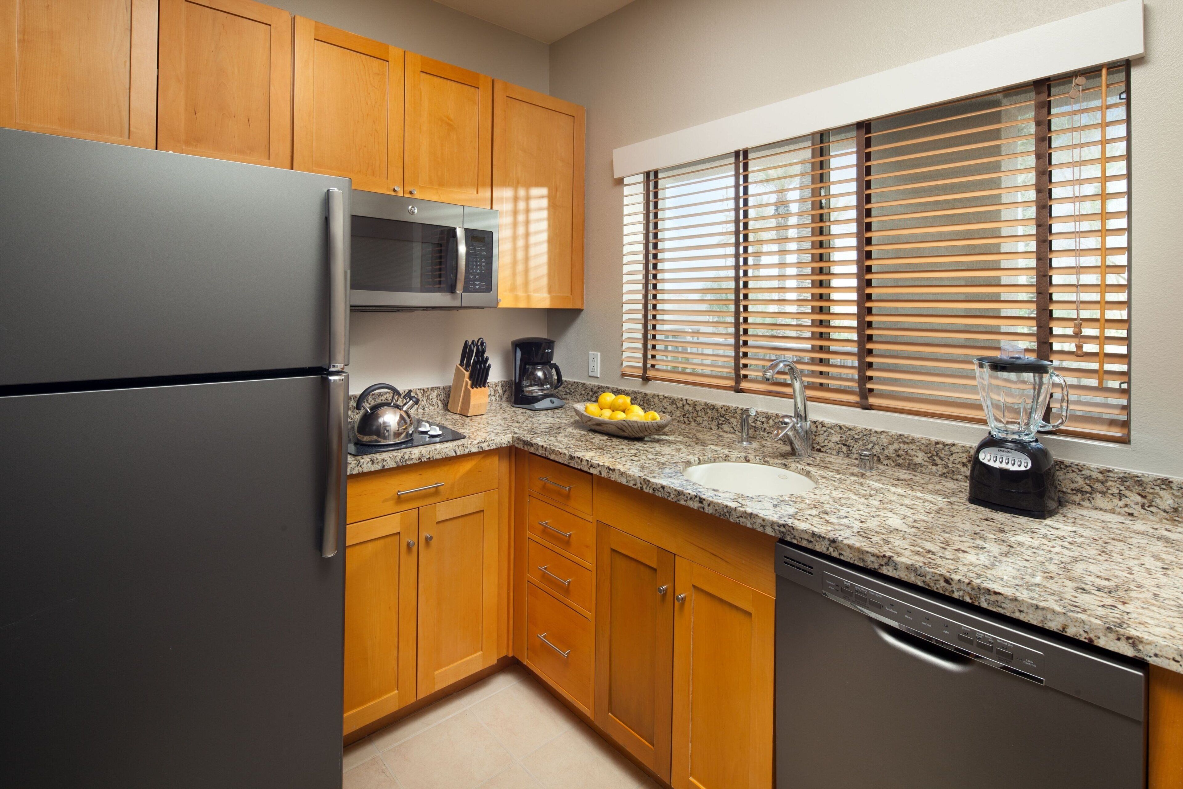 desk, laptop workspace, iron/ironing board, bed sheets