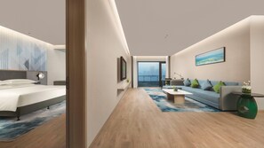 A modern hotel room with a bed, a sofa, a coffee table, a view of the city, and a balcony. - Holiday Inn Hotel & Sts Wuhan International Expo (Wuhan)